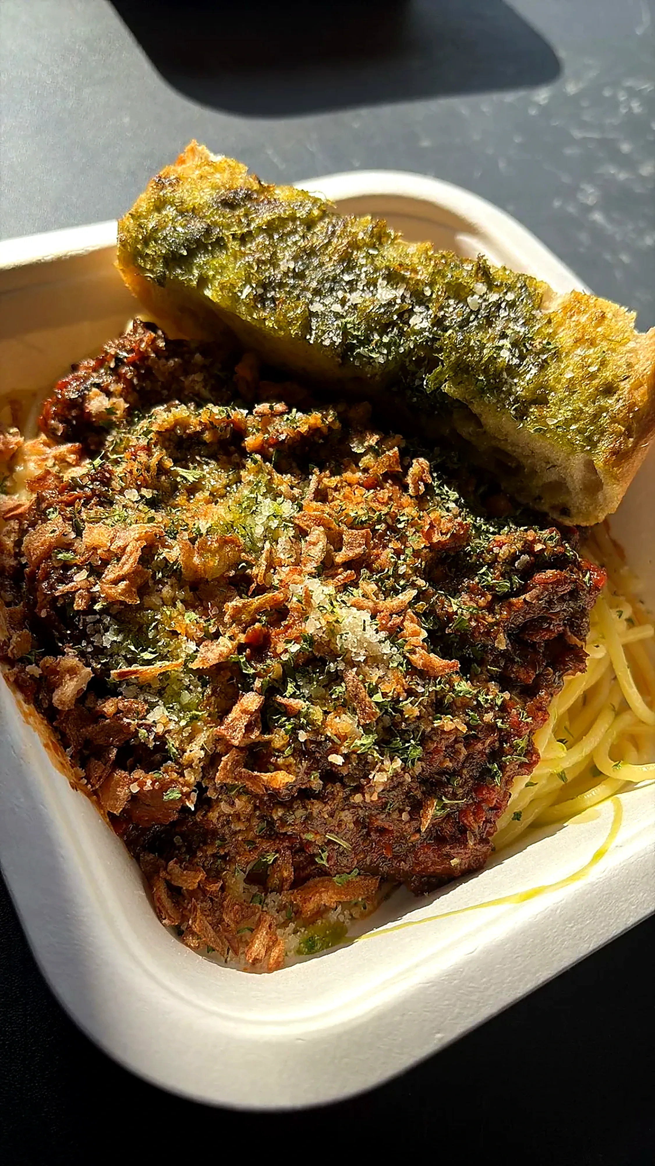 Slow-cooked beef ragu with pasta and garlic bread