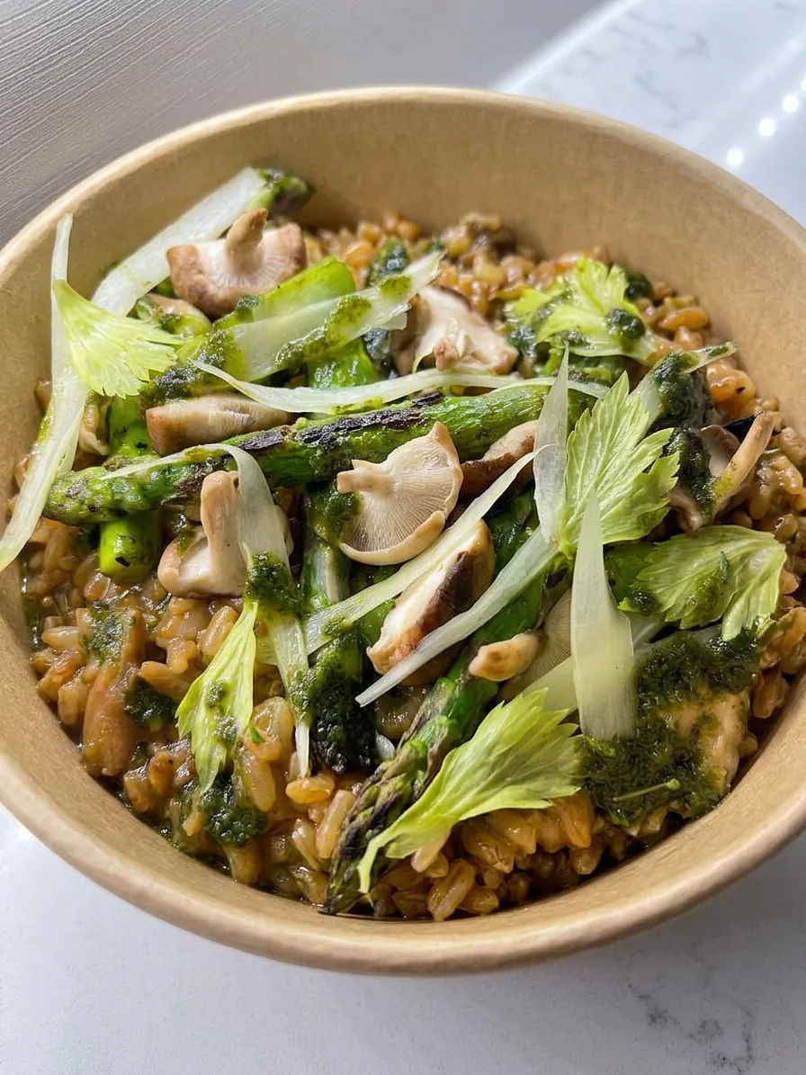 Wild mushroom and asparagus risotto with celery leaves